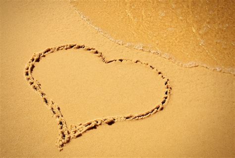 Premium Photo Heart Drawing In The Sand Beach