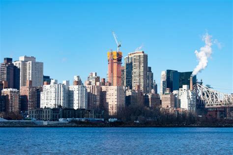 Midtown Manhattan Skyline Along The East River In New York City With