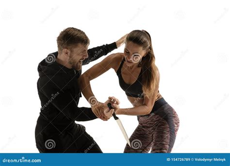 Man And Woman Fighting In Studio Women`s Self Defense Concept Stock