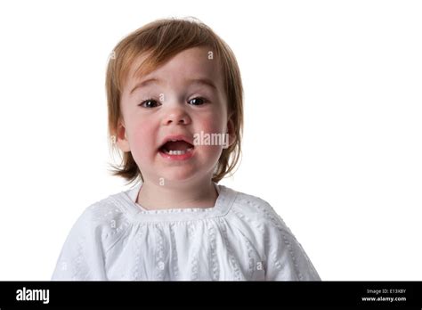 Portrait Of A Surprised Little Girl On White Background Stock Photo Alamy