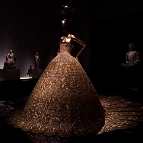 Rihanna Is Wearing Guo Pei One Of The Only Chinese Designers In The Show Scoopnest Com