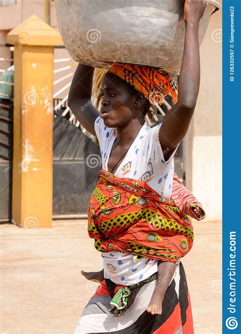 Unidentified Ghanaian Woman Carries A Baby And A Basin On Her H Editorial Photography - Image of ...