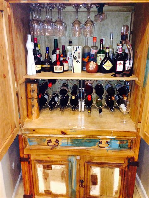 Look at the folding glass doors and the modern brass door hardware!! DIY mini bar created from old armoire | For the Home | Pinterest | Armoires, Bar and Liquor cabinet