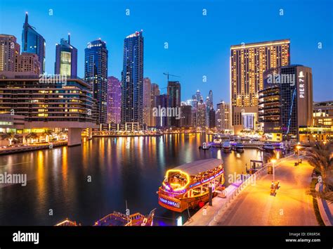 Dubai Marina Skyline And Tourist Boats At Night Dubai City United Arab