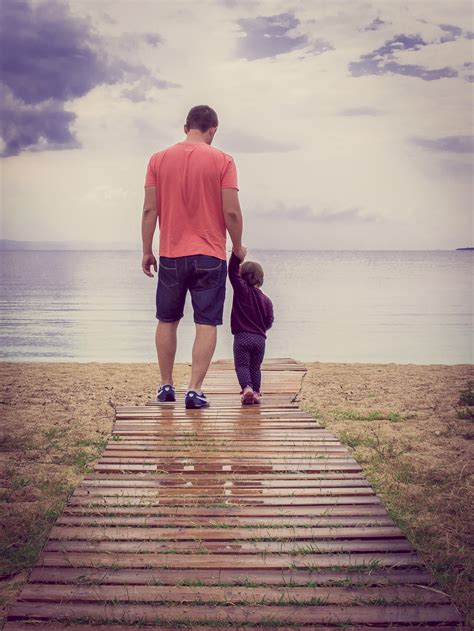 Father And Son Picture Beside Body Of Water Hd Wallpaper Wallpaper Flare