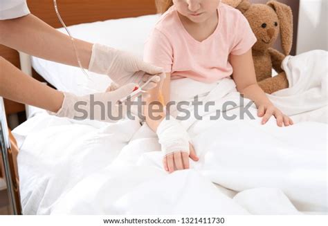 Doctor Adjusting Intravenous Drip Little Child Stock Photo 1321411730