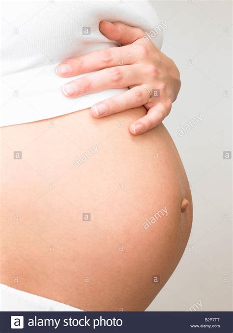Pregnant Woman Touching Her Belly Stock Photo Alamy