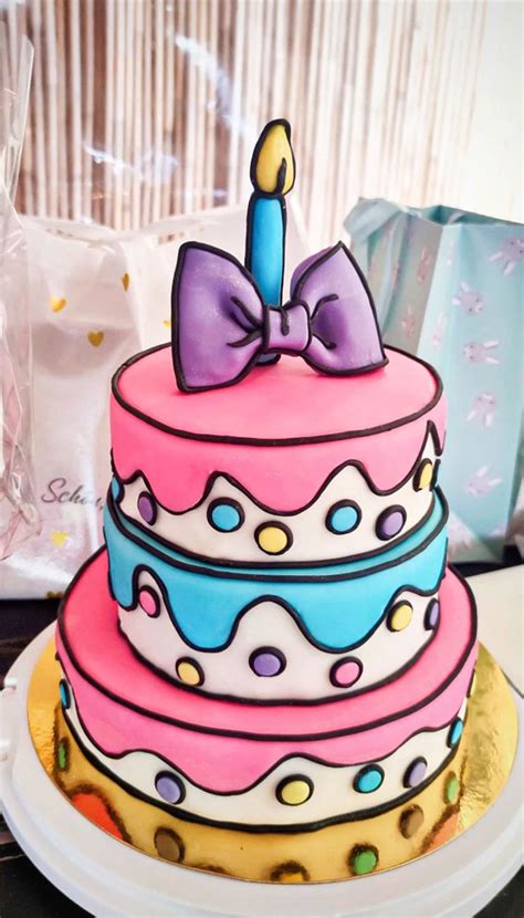 25 Comic Cake Ideas Thatre Trending Cake Topped With Huge Bow