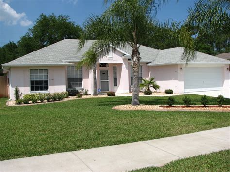 Like house #1 with all the green foliage, gorgeous. Cocoa, FL Exterior House Painting Project by: Peck Painting