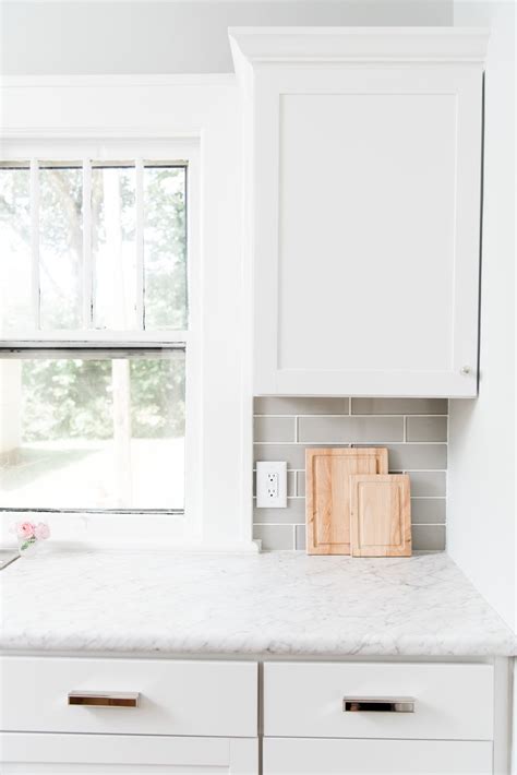 White and soothing blue kitchen boasts. Lowe's Stock Cabinets Review | Diamond Now Arcadia White Shaker Cabinets — Elizabeth Burns ...