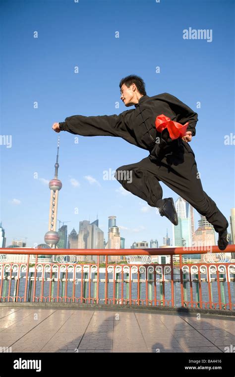 Young Woman Doing Kung Fu Moves In Mid Air Stock Photo Alamy