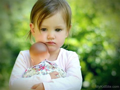 Beautiful Baby Girl Holding Toy
