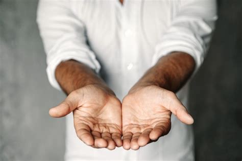 Premium Photo Close Up Of Mans Cupped Hands Show Something On White
