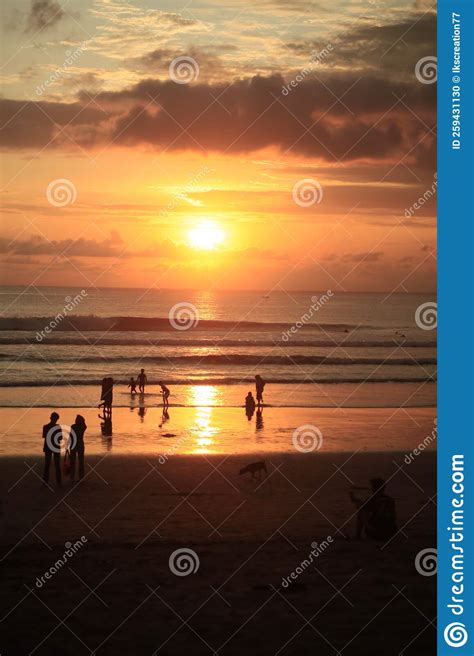 Cloudy Golden Sunset Light Reflection In Kuta Beach Bali Indonesia