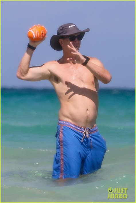 peyton manning flaunts ripped abs while shirtless at the beach photos photo 4492984 ashley