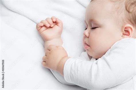Carefree Sleeping Little Baby On A Bed Stock Photo Adobe Stock