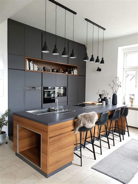 Stainless steel and paneled appliances and open shelving to store dishes and other kitchenware. The look of dark gray countertop with walnut cabinets ...