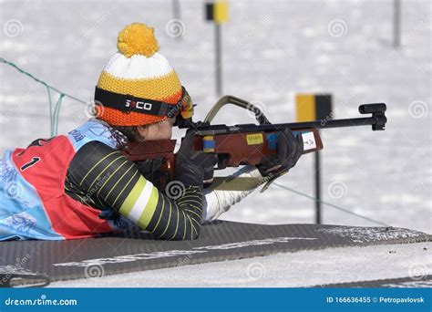 sportswoman biathlete aiming rifle shooting prone position south korea biathlete lee hyunju in