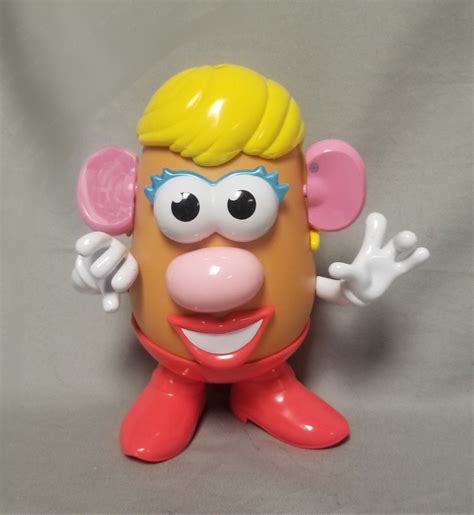 A Plastic Toy With An Odd Face And Big Ears