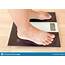 Close Up Of Fat Female Feet Standing On Weight Scale Stock Image 