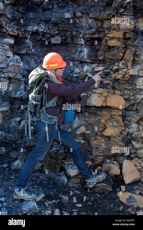 Female Geologist Examining Marcellus Shale Near Marcellus New York