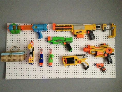 Storage of our nerf guns. Kids gun rack. My sister made this for my nephew. Love the ...