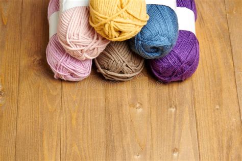 Colorful Wool Yarn For Knitting On Wooden Background Stock Photo