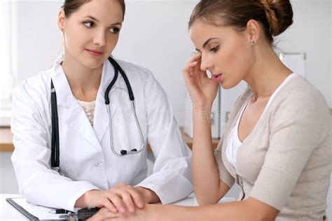 Doctor Reassuring Her Female Patient While Bad News Listening Medicine