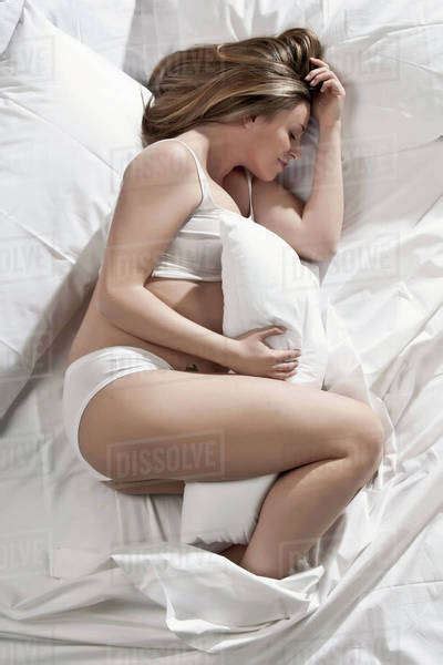 Pregnant Woman Sleeping In Bed Stock Photo Dissolve