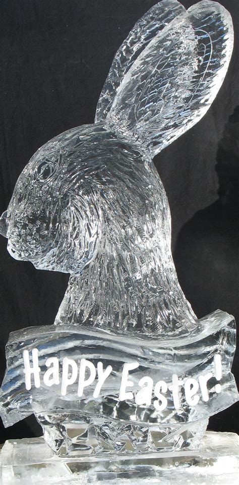 An Ice Sculpture Of A Bunny Rabbit With The Words Happy Easter On It