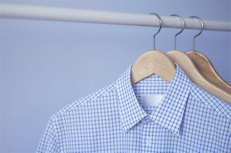 Men`s Blue Checkered Shirt On A Wooden Hanger Stock Image Image Of