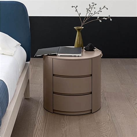 Made from solid pine wood, this table features a clean lined body with beveled front edges and four tapered, splayed legs. Theo round 2 or 3 drawer bedside cabinet by Mobilstella ...