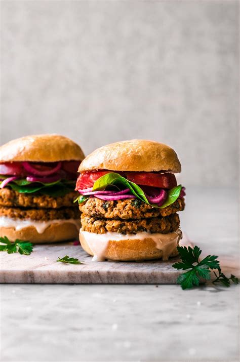 Double Stacked Sweet Potato Burger With Greens Pickled Onions And