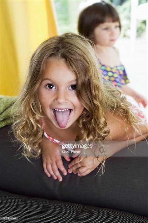 Portrait Of Confident Girl Sticking Her Tongue Out Photo Getty Images