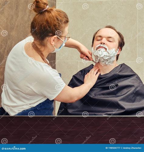 Wife Shaves Her Husband S Beard With A Straight Razor Reflection In