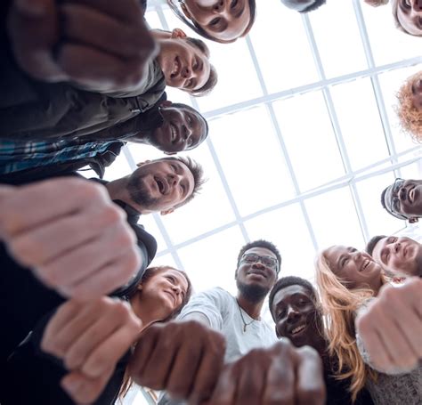 Premium Photo Group Of Diverse Young People Joining Their Hands In A Ring