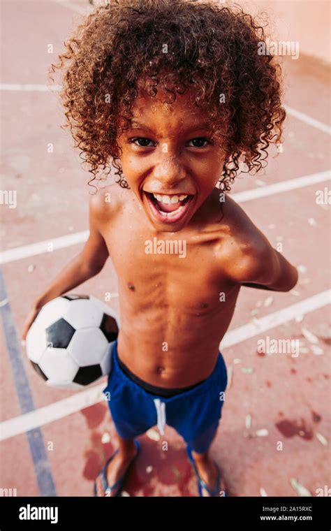 Boy Holding Ball On Hi Res Stock Photography And Images Alamy