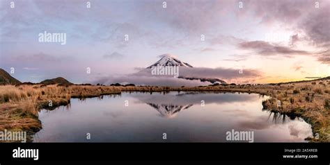 Water Reflection In Pouakai Tarn Mountain Lake At Sunset Stratovolcano