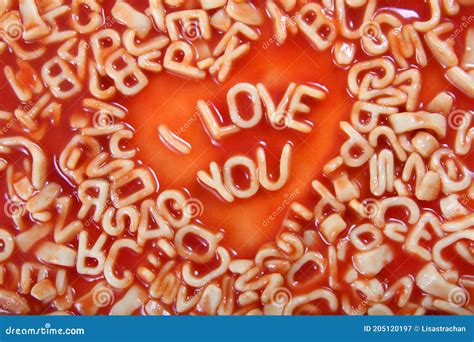 I Love You Text Written In Alphabetti Spaghetti Pasta Shaped Letters With Tomato Sauce Around