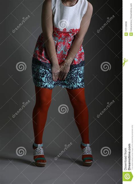 Elegant Colored Dress For Women In Studio Stock Photo