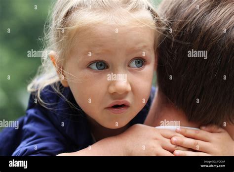 Little Frightened Girl Hugging Father Stock Photo Alamy