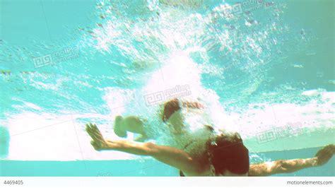 Brunette Diving Underwater In Swimming Pool Stock Video Footage 4469405