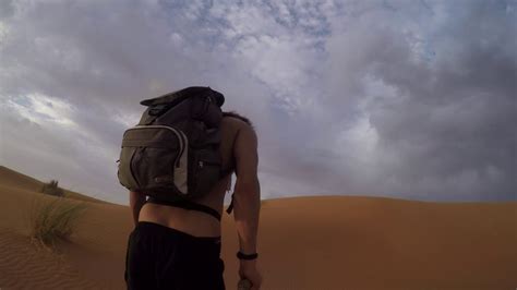 Side Tracking Shot In Desert Cycling The Sahara Cycling Across The