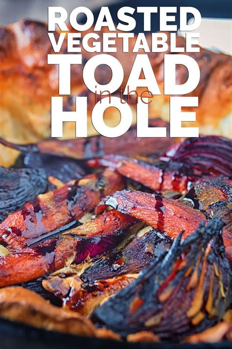 Toad in the hole is a traditional british dish made up of yorkshire puddings, sausages and finished off with gravy and vegetables. This Roasted Vegetable Toad in the Hole takes the roots of ...
