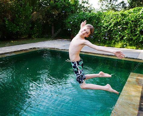 Boy Jumping Into Swimming Pool Stock Image F0091749 Science