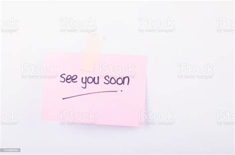 Business Message See You Soon Written On Notepad Over White Background