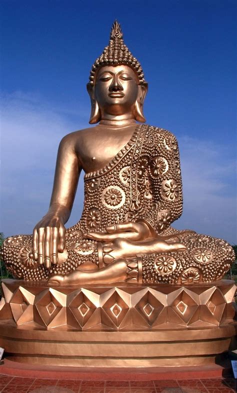 Statue Of A Golden Buddha Against A Blue Sky Buddha Golden Buddha
