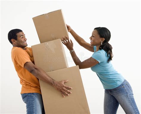Couple with moving boxes. stock image. Image of indoors - 6152169