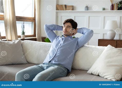 Calm Caucasian Man Relax On Sofa At Home Daydreaming Stock Image Image Of Caucasian Apartment