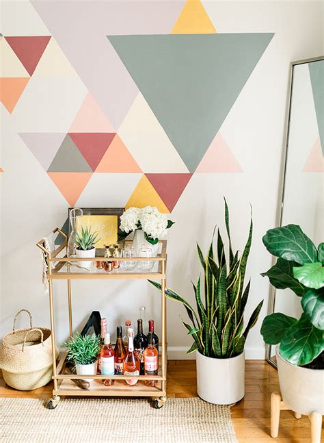 There is something about october that gives my household permission to get ultra gooey, sticky, paint filled, and glittery and drip painting pumpkins. A DIY Geometric Wall Mural with BEHR Paint - Inspired By This